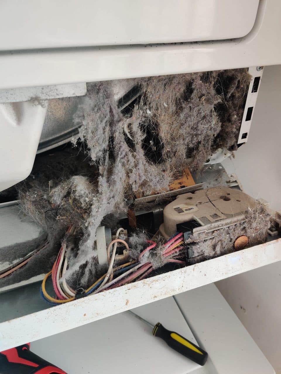 Lint packed around the wiring and timer: Kenmore laundry center, model 417.97922701 (dryer repair in Davie, FL, June 2026)