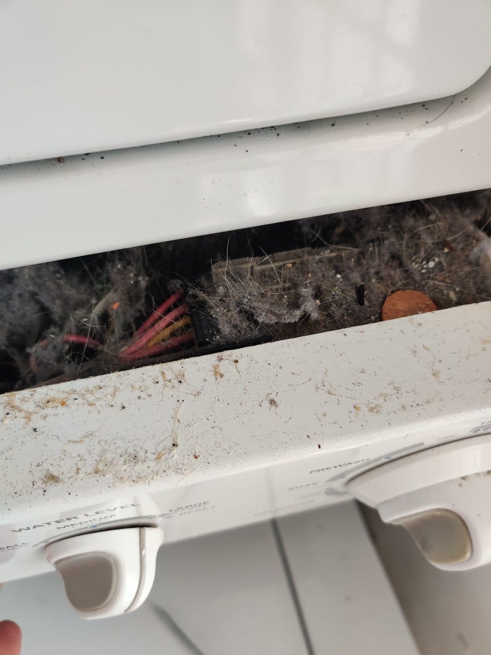 Lint buildup inside the laundry center: Kenmore laundry center, model 417.97922701 (dryer repair in Davie, FL, June 2026)
