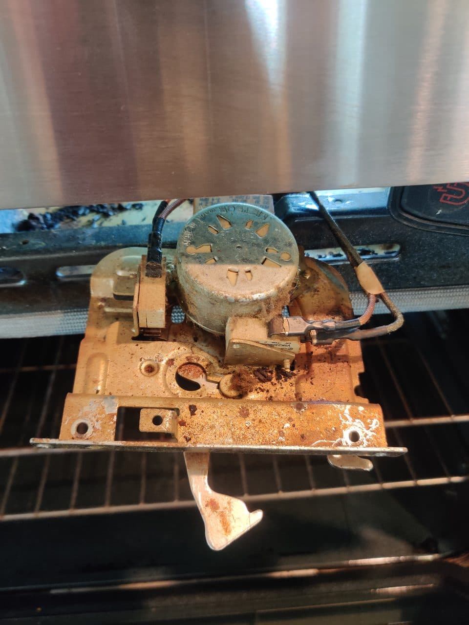 Oven door latch actuator: KitchenAid wall oven (oven & stove repair in Davie, FL, July 2026)
