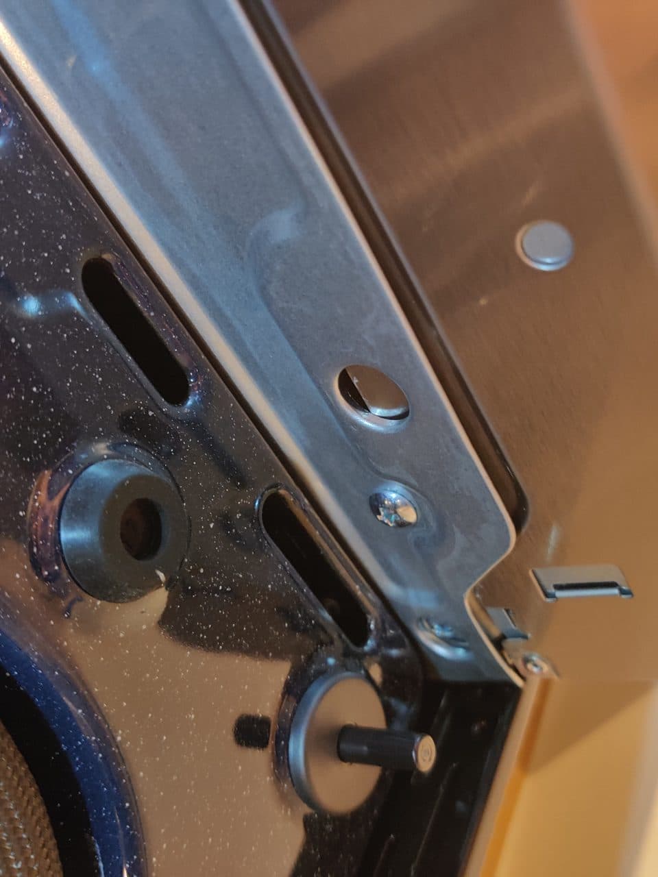 Adjusting the cooktop frame bracket: Samsung range, model NE63B8611SS (oven & stove repair in Fort Lauderdale, FL, August 2026)