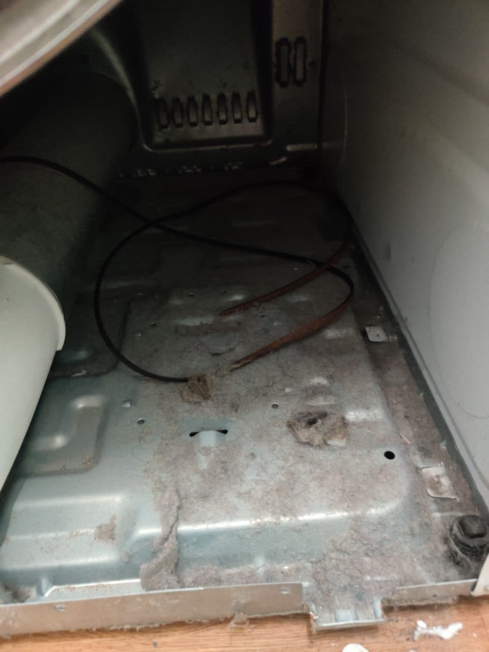Dryer cabinet with the drum out: GE dryer, model GTD42EASJ2WW (dryer repair in Miramar, FL, September 2026)